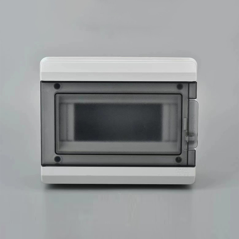 Weatherproof electrical enclosure box with tinted front door mounted on gray wall