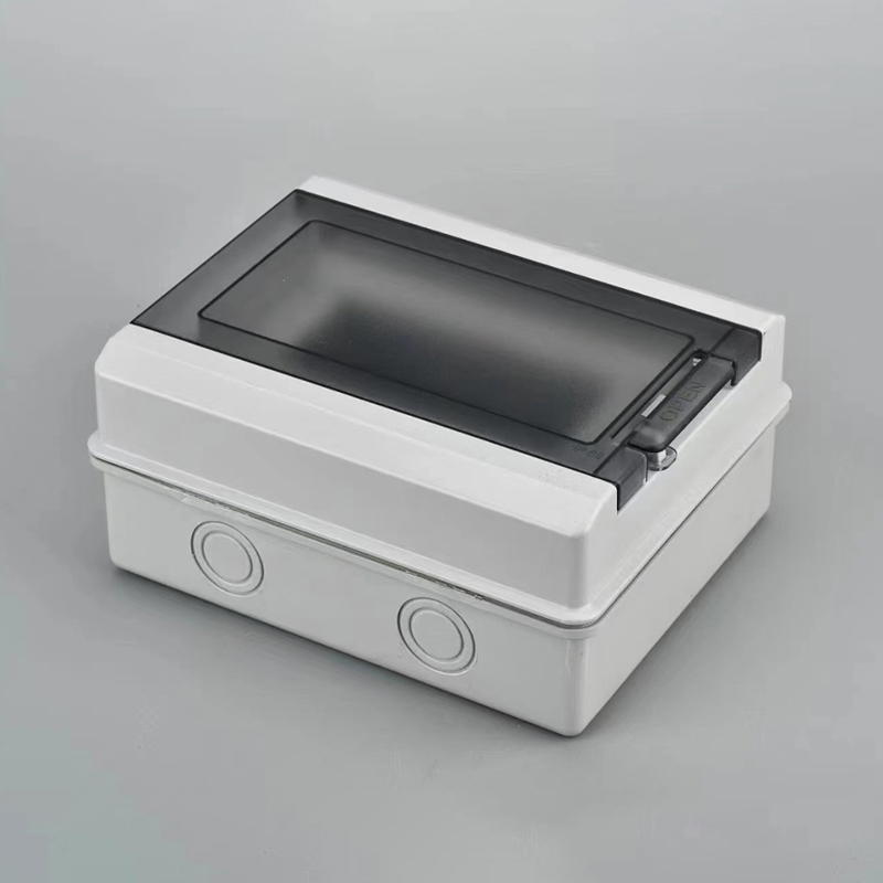 Gray weatherproof electrical junction box with hinged tinted lid and side knockouts