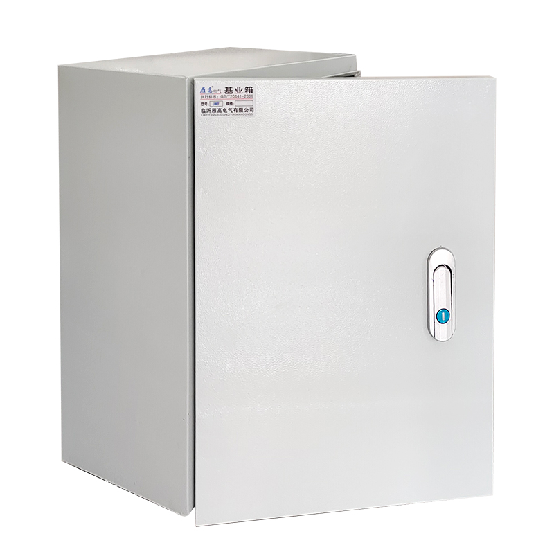 Compact industrial metal electrical cabinet with front door handle and blue indicator button.