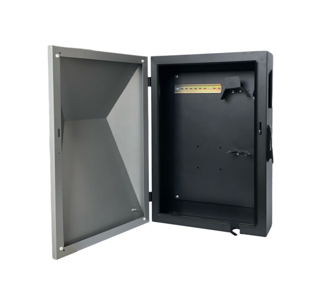 Open industrial electrical enclosure cabinet with hinged door and empty mounting backplate interior