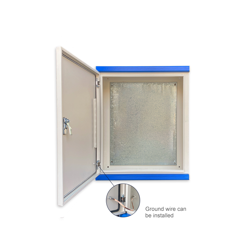 Wall-mounted electrical enclosure with open door, metal backplate, and grounding wire connection point.