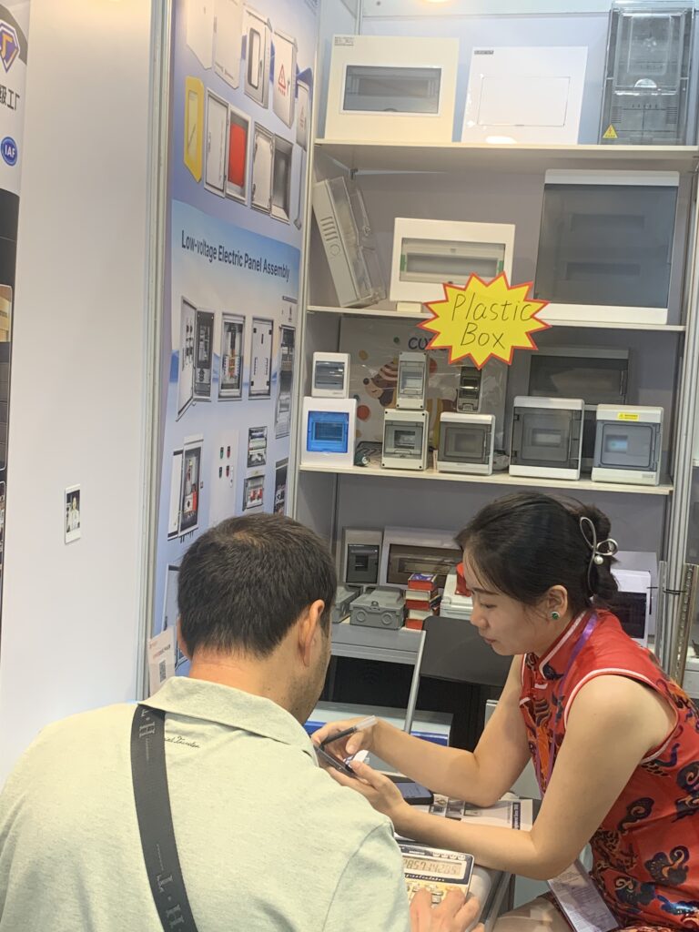 Customer Getting Help at Electronics Shop Counter
