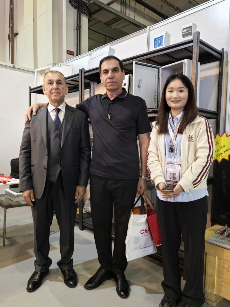 Three Professionals Posing at Industrial Lab Exhibit